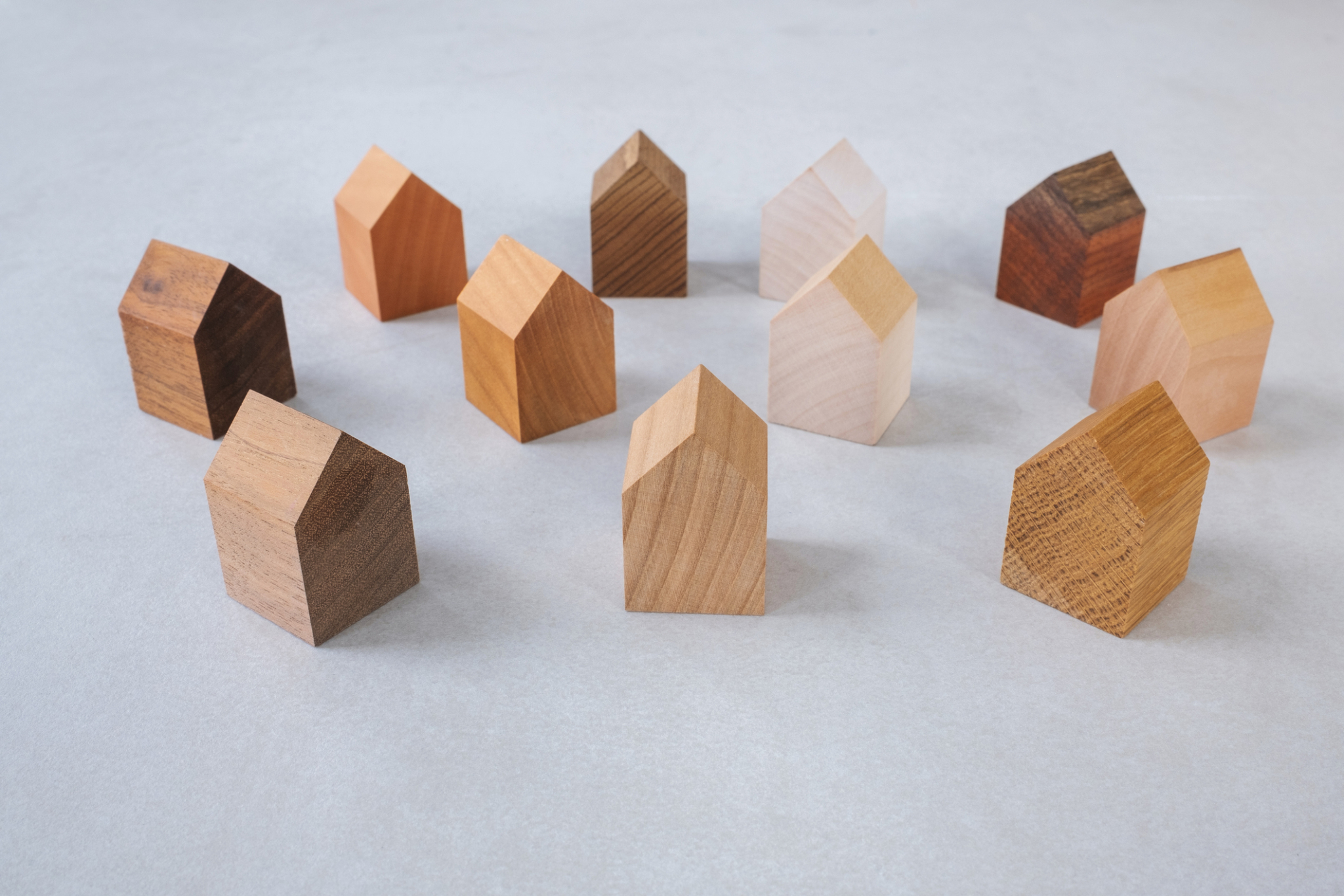 Group of similar miniature wooden houses.Group of similar miniature wooden houses.Group of similar miniature wooden houses.